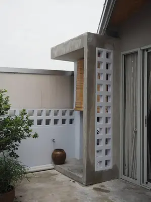 a building with a concrete structure with a window at Private apartment at Sukhumvit67 Penthouse Unit in Bangkok