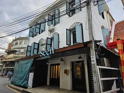 a building with a sign that reads sekrit trust at Seen Hostel Bangkok The Riverwalk in Bangkok