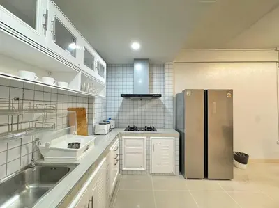 a kitchen with a stainless steel refrigerator at MIQ HK256 5BR MRT Ratchada and HuaiKhwang in Bangkok