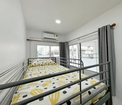 a bedroom with a bunk bed and a balcony at MIQ HK611 Huai Khwang 4BR Jodd fair in Bangkok