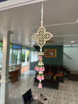 a chandelier hanging from a ceiling in a room at Baan Debtida in Bangkok