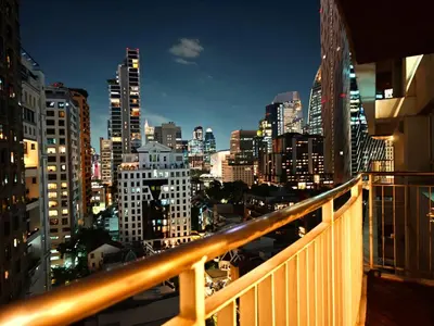 a view of a city at night from a balcony at City comfort appartment, Skytain Step 600 m, Erawan shrine in Bang Kapi
