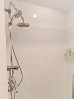 a shower with a shower head in a bathroom at City comfort appartment, Skytain Step 600 m, Erawan shrine in Bang Kapi