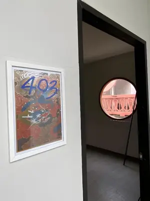 a framed painting and a mirror in a room at XX Hidden Dragon ChinaTown MRT Wat Mangkon Station in Samphanthawong