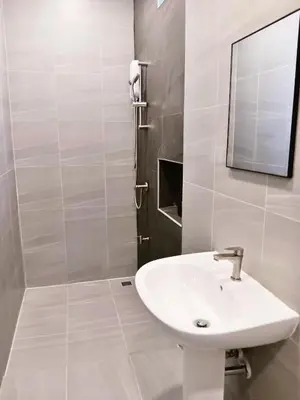 a white bathroom with a sink and a mirror at XX Hidden Dragon ChinaTown MRT Wat Mangkon Station in Samphanthawong
