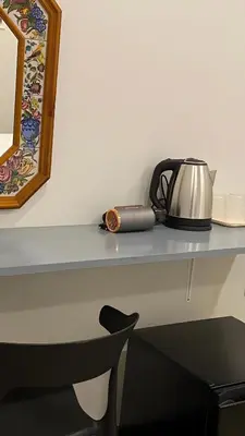 a tea kettle on a shelf with a tea pot at XX Hidden Dragon ChinaTown MRT Wat Mangkon Station in Samphanthawong