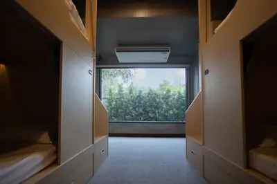 a hallway with a large window in a room at DMK Place in Bangkok