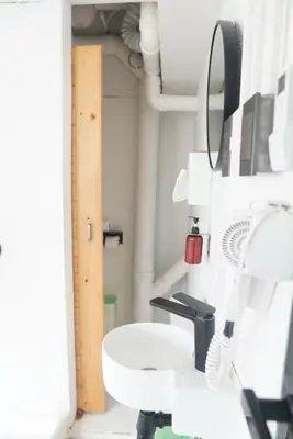 a bathroom with a sink and a mirror at The Green Khaosan Bangkok in Bangkok