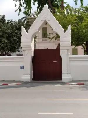 a brown garage door with an arch over it at Kanyakorn House Near Khao San in Bangkok