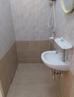 a bathroom with a sink and a shower at Kanyakorn House Near Khao San in Bangkok