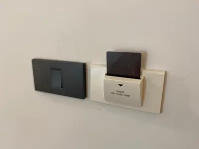 two electronic devices are sitting on a wall at The Celestrail - Apartment - Check-In by Appointment Only - Non-hotel - Onnut BTS in Amphoe Phra Khanong