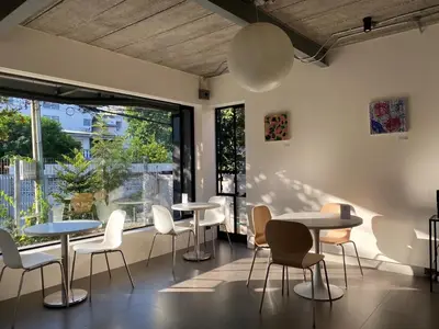 a room with tables and chairs and a large window at The Celestrail - Apartment - Check-In by Appointment Only - Non-hotel - Onnut BTS in Amphoe Phra Khanong