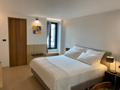 a bedroom with a large white bed and a window at The Celestrail - Apartment - Check-In by Appointment Only - Non-hotel - Onnut BTS in Amphoe Phra Khanong