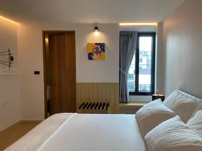a bedroom with a white bed and a window at The Celestrail - Apartment - Check-In by Appointment Only - Non-hotel - Onnut BTS in Amphoe Phra Khanong