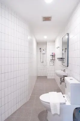 a bathroom with a toilet and a sink at Wash House Chatuchak in Bangkok