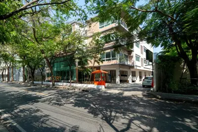 an empty street in front of a building at Story At Bangkok- 211 Studio with Balcony in Khlong Toei