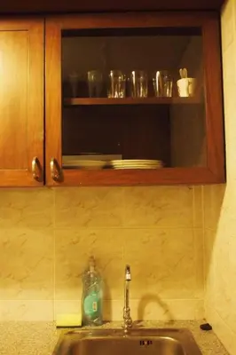 a kitchen sink with a bottle of soap on it at Spacious room in Sukhumvit Nana in Bangkok
