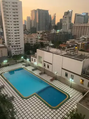 a large swimming pool on top of a building at Spacious room in Sukhumvit Nana in Bangkok