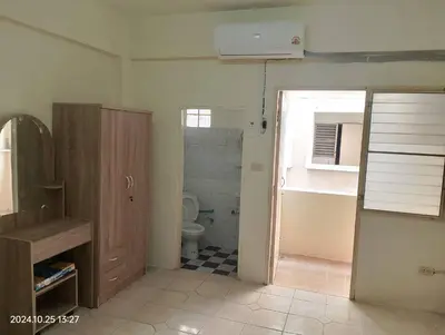 a bathroom with a toilet and a sink and a window at Nakara Place บ้าน นาครา in Ban Rang Pho