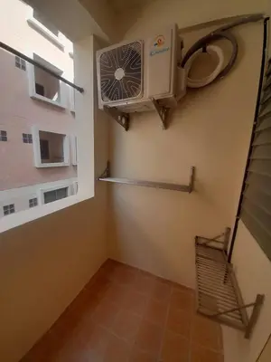 a small room with a fan and a window at Nakara Place บ้าน นาครา in Ban Rang Pho
