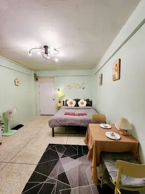 a bedroom with a bed and a table in it at 803-STP Homely room Free Wi-Fi and Near BTS line in Bangkok