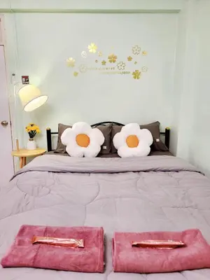 a bed with two pink towels on top of it at 803-STP Homely room Free Wi-Fi and Near BTS line in Bangkok