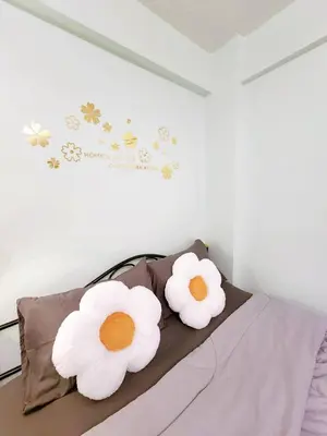 two white flowers sitting on top of a bed at 803-STP Homely room Free Wi-Fi and Near BTS line in Bangkok