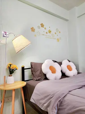 a bedroom with a bed with two pillows on it at 803-STP Homely room Free Wi-Fi and Near BTS line in Bangkok
