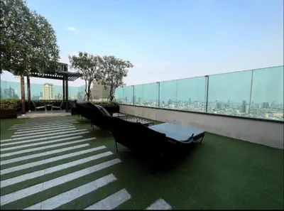 a group of benches sitting on top of a building at Opulence Riverview with Train Access in Bangkok