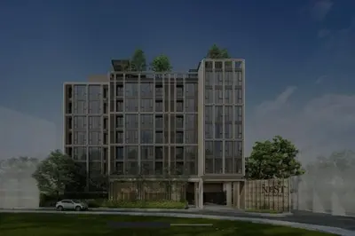 a tall building with a car parked in front of it at Luxury and cozy apartment in the City center in Bangkok