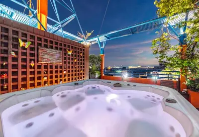 a bath tub sitting on top of a building at Collection O Diamond House Khaosan in Bangkok