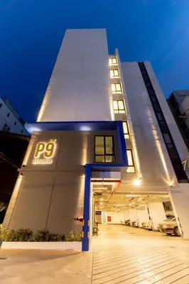 a building with a sign on the side of it at P9 Ratchada Hotel in Bangkok