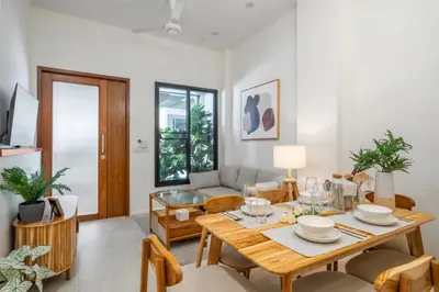 a living room with a table and a couch at 4BR Walk to Chinatown, MRT Luggage Dropoff in Bangkok