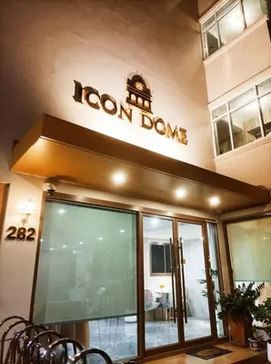 a restaurant with a sign on the front of a building at Icon Dome Bangkok in Bangkok