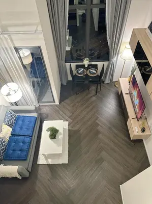 an overhead view of a living room with a couch at Luxury loft with Stunning 35th Floor Views in Bangkok
