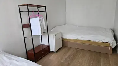 a room with a bed and a shelf with a bed at อิมแพ็ค เมืองทองธานี ห้องพักรายวัน Popular Condo T8 in Nonthaburi