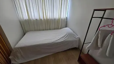 a small bedroom with a white bed and a window at อิมแพ็ค เมืองทองธานี ห้องพักรายวัน Popular Condo T8 in Nonthaburi