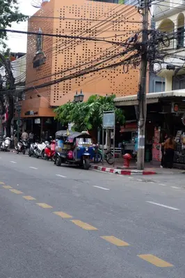 a car parked on the side of a city street at Oskar's House in Bangkok