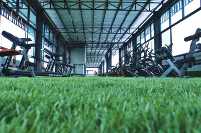 a gym filled with lots of exercise bikes at Rod Fai Fah Apartment in Bangkok