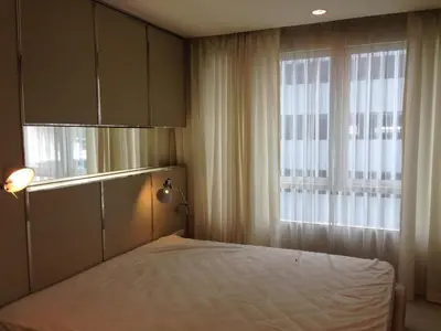 a bedroom with a bed and a window at Condo near Iconsiam The Bangkok Sathorn-Taksin Corner Room in Godown