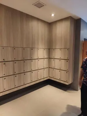 a room with wooden lockers on the wall at Aspire Rattanatibet 2 at MRT Purple Line in Nonthaburi