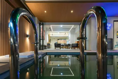 a pool in the middle of a house at Hello my friend in Bang Bua Thong Railway Station