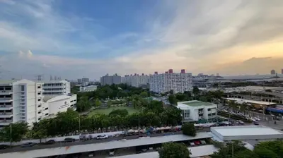 a view of a city with buildings and a park at OpenView เมืองทอง T1 Impact Muang Thong Thani in Nonthaburi