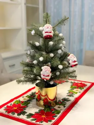 a christmas tree with cupcakes on top of a table at My Happy Place in Nonthaburi