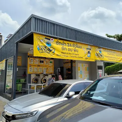 a store with a car parked in front of it at Jplace 101 Spacious Apartment with free Wi-fi in Bangkok
