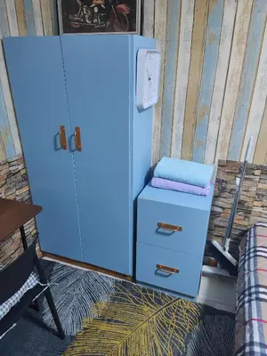 a blue refrigerator with a seat on top of it at Jplace 101 Spacious Apartment with free Wi-fi in Bangkok