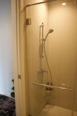 a shower in a bathroom with a glass door at Entire Townhome 3BR3B, Pool, Sukhumvit-EmSphere in Bangkok