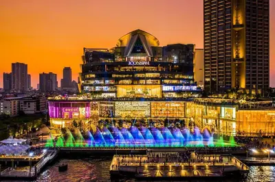 a large building with a fountain in front of it at Best river view - Loft apartment in great location in Bangkok