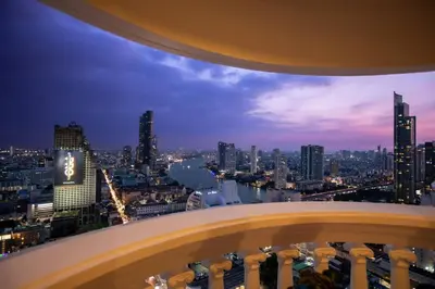 a view of a city skyline at night at Best river view - Loft apartment in great location in Bangkok