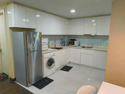 a kitchen with a refrigerator and a washing machine at بانكوك سوكمفيت شارع 5 liv at 5 in Bangkok